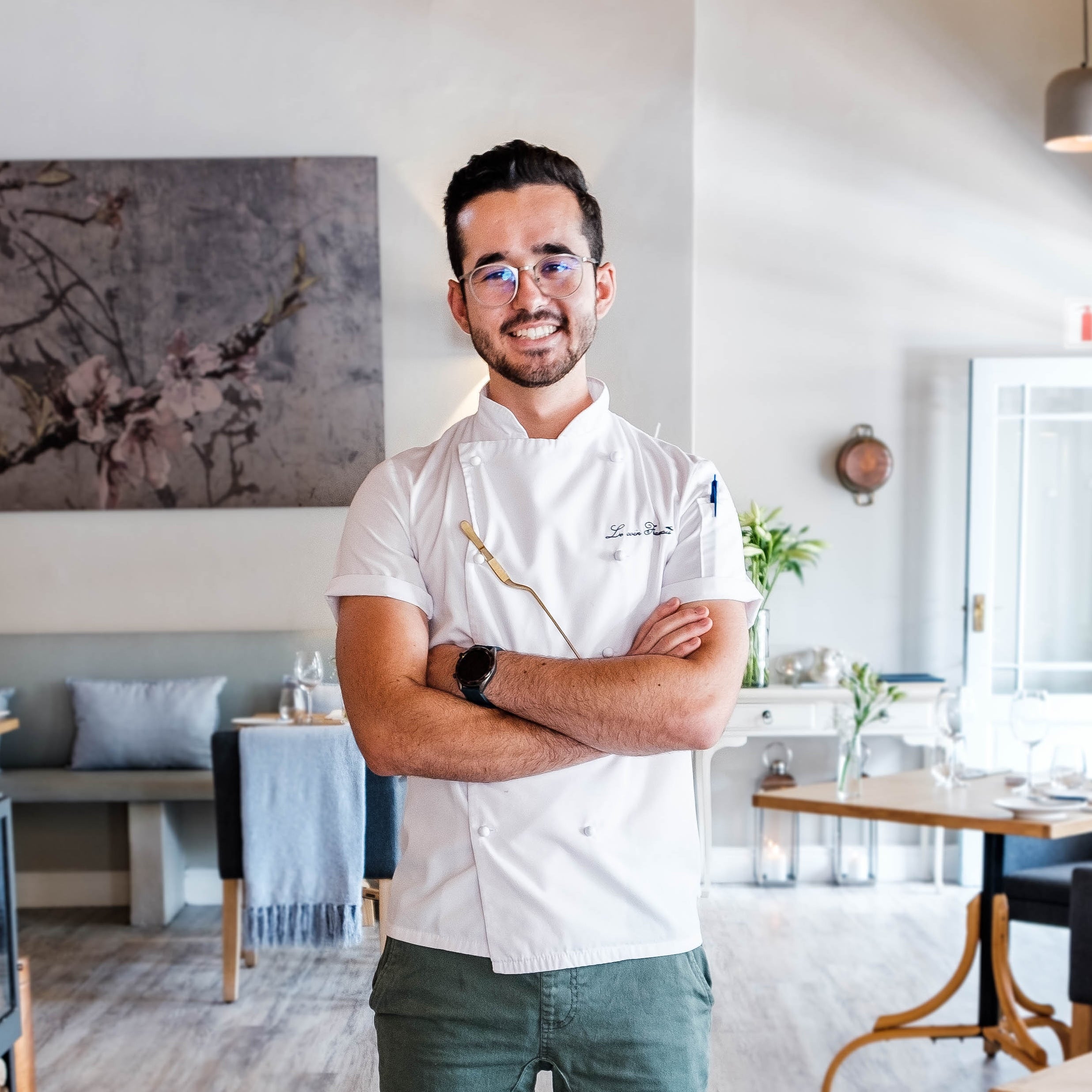 A male chef smiling at camera. 