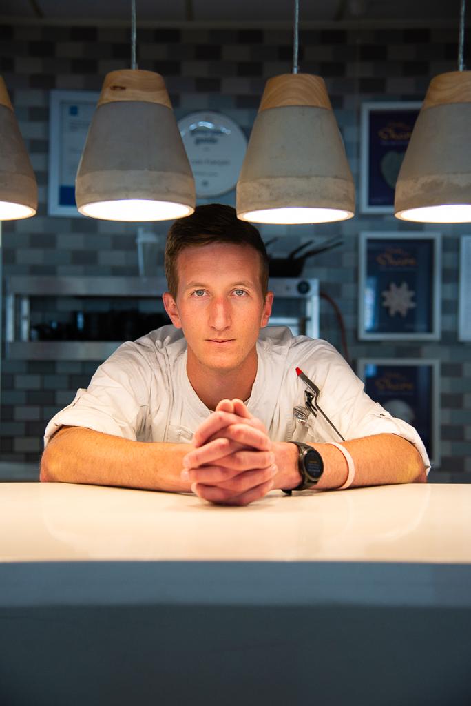 A male chef in the kitchen.