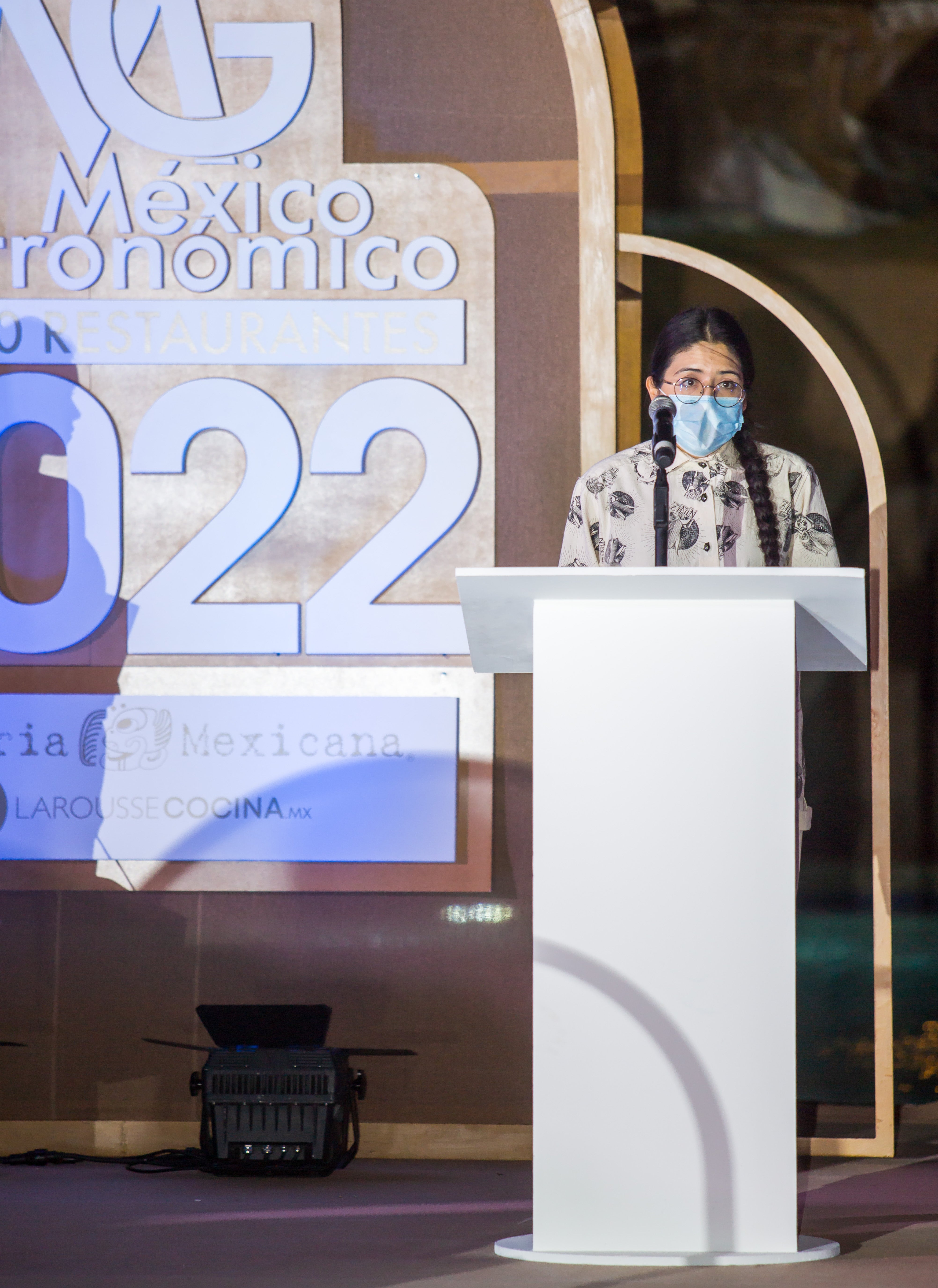 Female chef giving a speech.