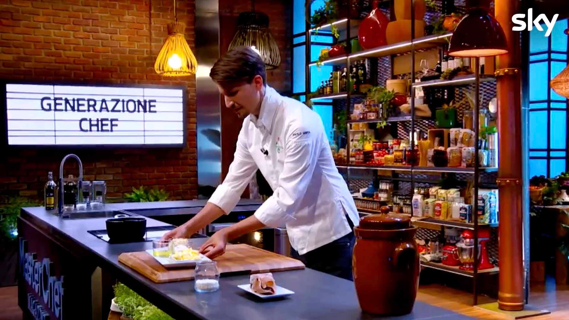 A man cooking in a TV studio.