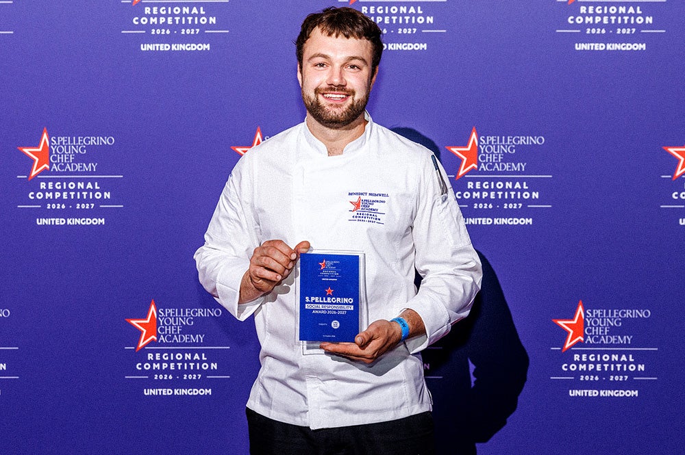 Benedict Shimwell holds his S.Pellegrino Social Responsibility Award.