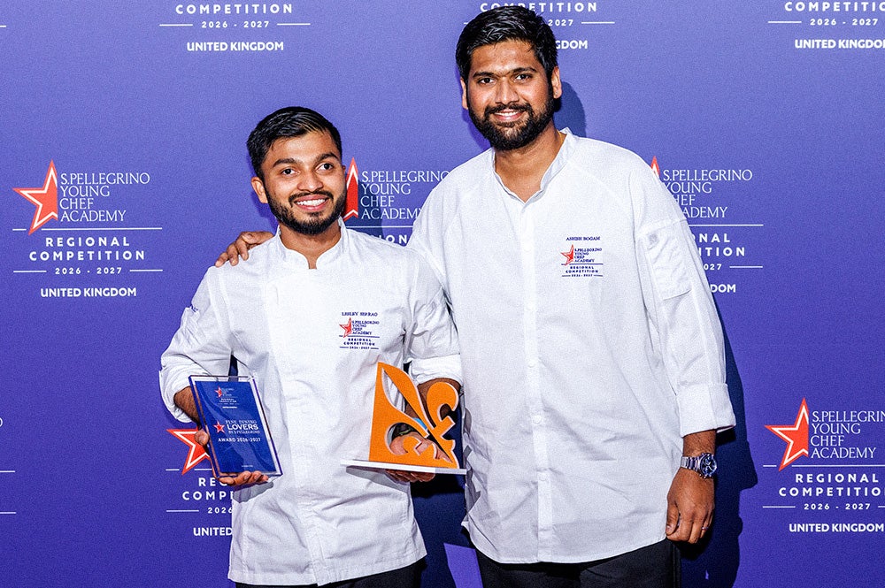 Lesley Serrao celebrates winning the Fine Dining Lovers Award and the Acqua Panna Connection in Gastronomy Award alongside his mentor, Martin Carabott.
